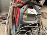an image of a welder with a lot of wires on it