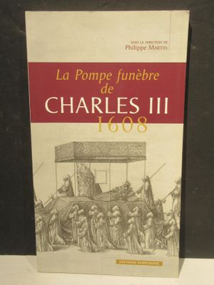 le livre est posé sur une table devant un fond noir
