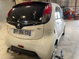 a white car that is parked in a garage