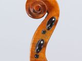 an antique violin with a wooden back and bow