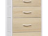 une commode blanche et en bois à quatre tiroirs