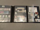 a lot of different stamps on a folder on the table
