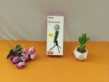 a small plant that is sitting next to a microphone