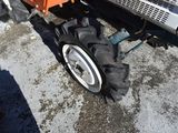 a tractor that is parked on the side of the road