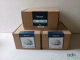 three boxes are stacked on top of each other on a table