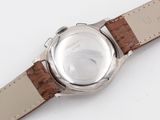 an image of a close up of a watch on a white surface