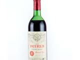 bottle of red wine with a red cap on a white background