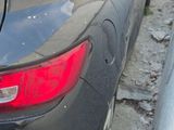 a car that is parked on the side of the street