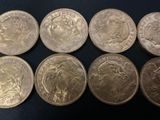 a close up of a bunch of coins sitting on top of a table