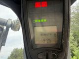 a close up of a car ' s dashboard with a clock on it