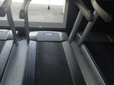 two tread machines that are sitting on the floor