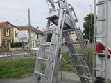 a ladder that is attached to the back of a truck