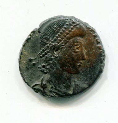 an old coin with a woman ' s face on it