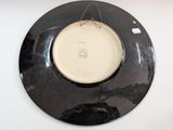a black and white plate with a white design on it