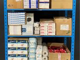 a cart with several boxes of toilet paper on it