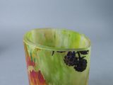 a close up of a glass with a fruit design on it