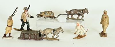many figurines of people and animals on a table