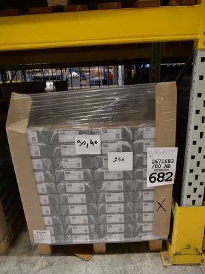 a pallet with a lot of boxes on it in a warehouse