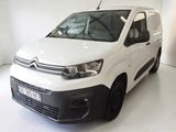 the white van is parked in a white room with a white floor