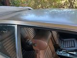 an image of a car with a surfboard on top of the roof