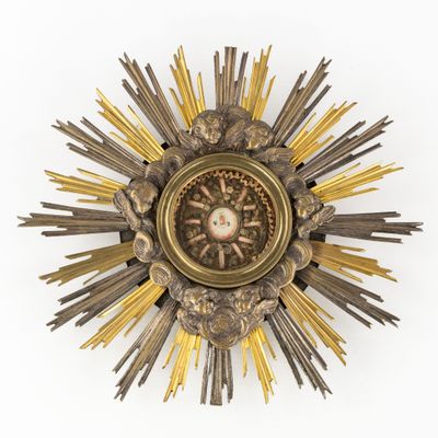 an image of a gold sunburst on a white background