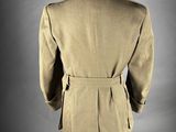 the back view of a suit worn by a man in a military uniform
