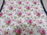 an image of a bed with a floral print on it