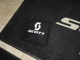 a pillow that is sitting on the floor next to a bag