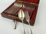 silverware in a case with spoons and spoons in it
