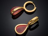 a pair of gold and carneline earrings