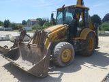 a picture of a construction vehicle that is parked in the dirt