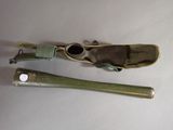 two baseball bats and a bat holder on a table