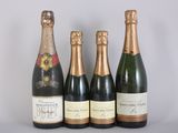 three bottles of champagne sitting next to each other on a table