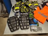 a table with a lot of gloves, gloves, and other items on it