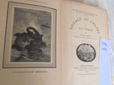 a picture of an old book with a picture of a cat on it