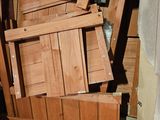 a pile of wooden crates and boxes in a room