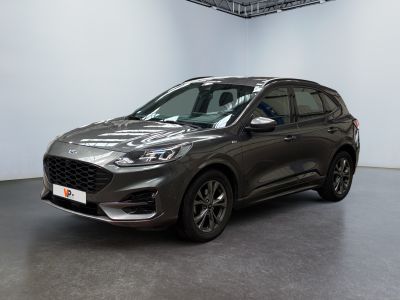 a grey ford escape is parked in a large room
