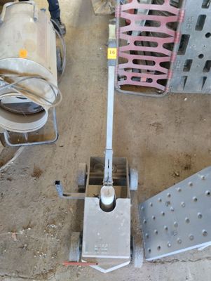 a small machine that is sitting on the ground next to other machines