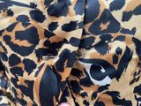 leopard print shirt with eye detail on the chest