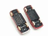 two miniature skateboards sitting on top of each other