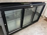 an image of a glass door refrigerator in a garage