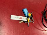 a red table with a bunch of keys on it