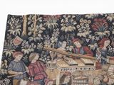 a tapestry with a picture of a group of people playing music