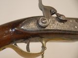 a close up of a gun that is on display