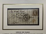 framed photograph of a letter signed by a man in a white room