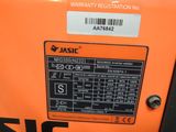 an orange machine with a label on the back of it