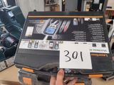 a person holding a laptop with a price tag on it