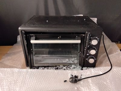 Four micro-ondes SCHNEIDER. Porte cassée, vitre brisée.