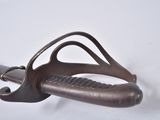 a close up of a metal object on a white surface
