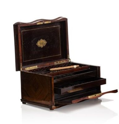 a small wooden box with a drawer on top of it